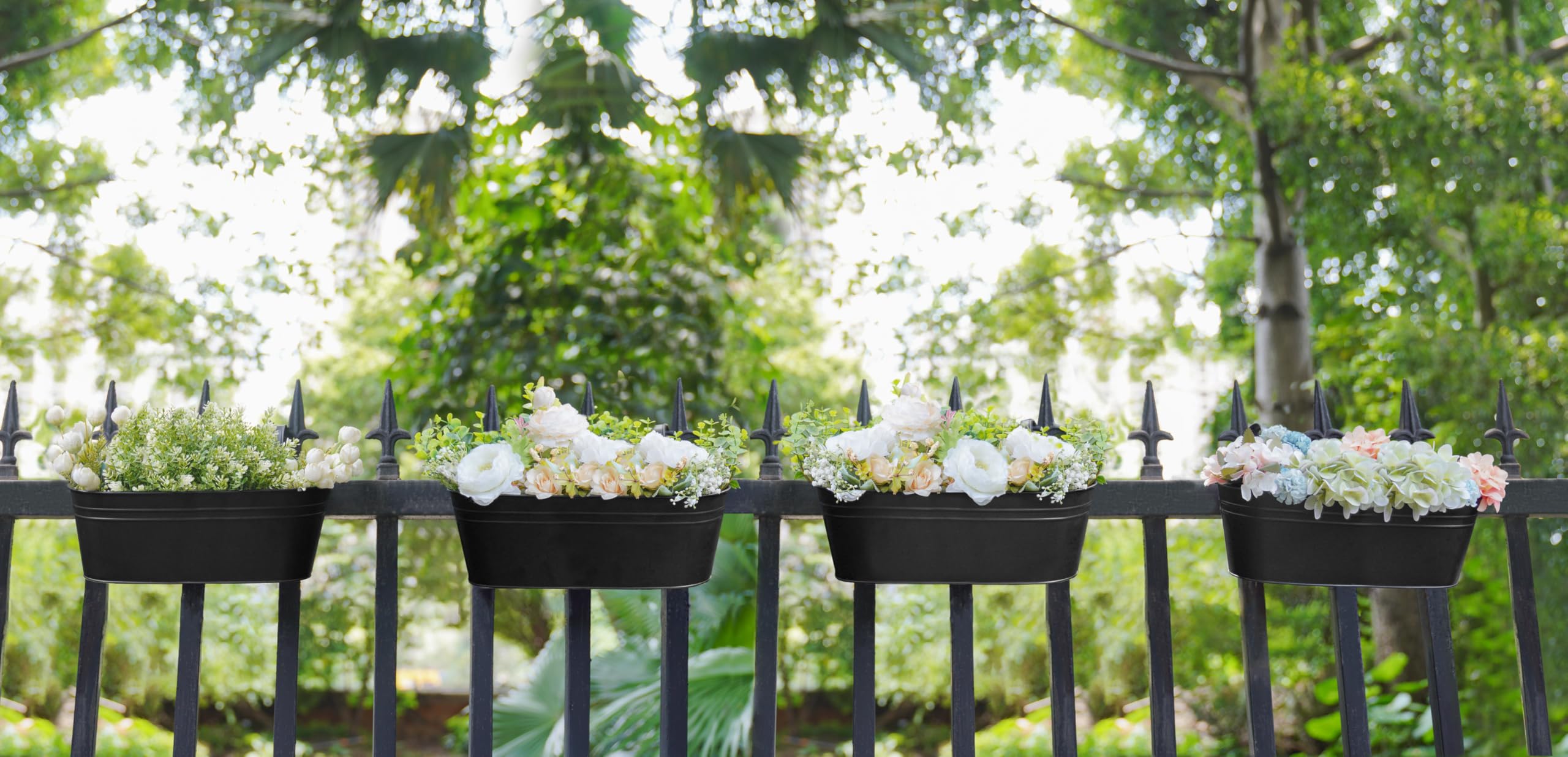 Dahey 15 Inch Railing Planters, Black, in a garden setting