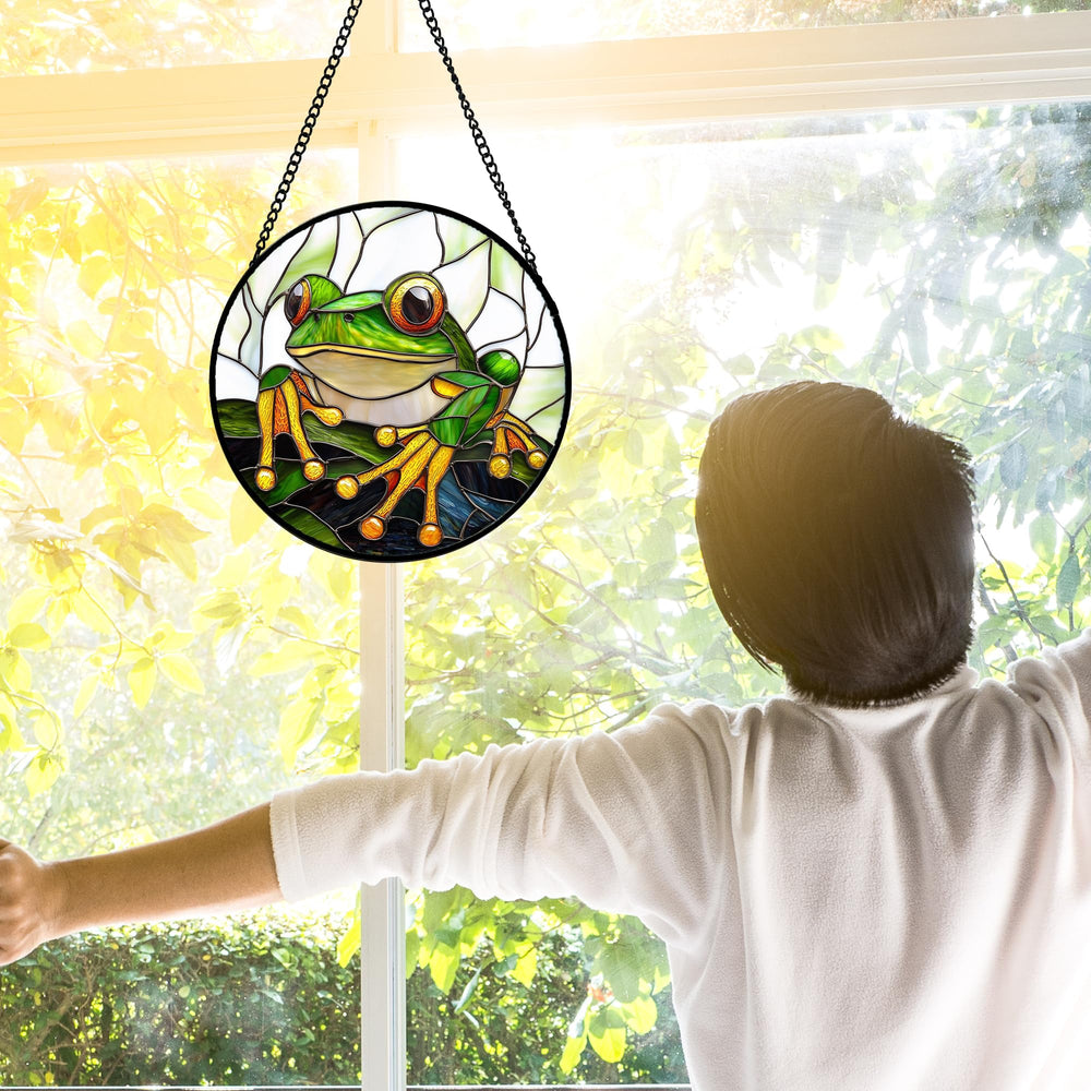 DASTOLL stained glass suncatcher hanging in a sunlit window