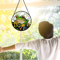 DASTOLL stained glass suncatcher hanging in a sunlit window