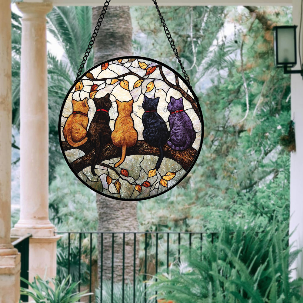 DASTOLL stained glass window hanging in a garden setting