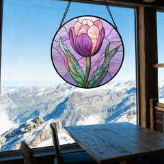 DASTOLL suncatcher hanging in a sunlit window