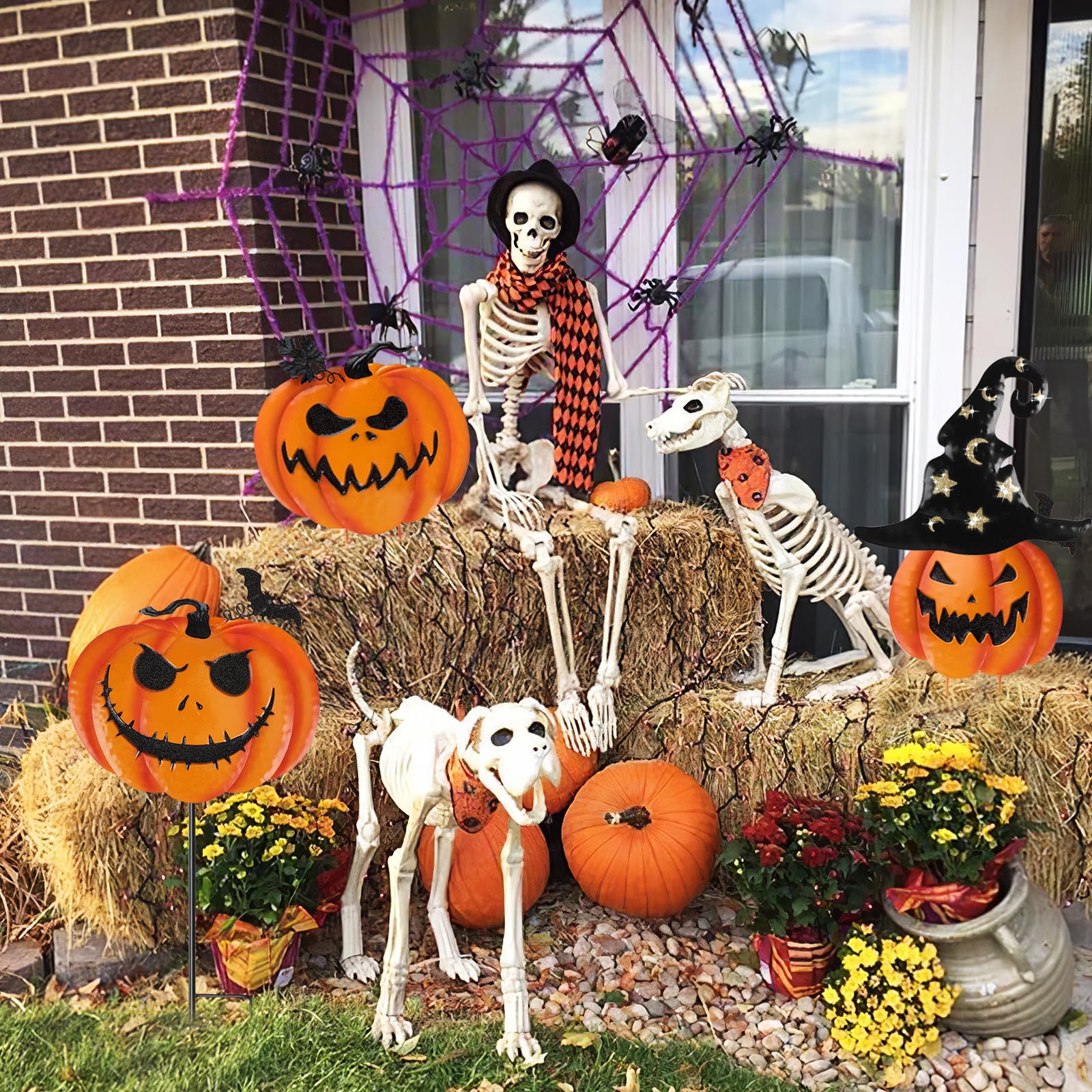 Decorated garden with COCHIE Halloween pumpkin stakes and witch hat