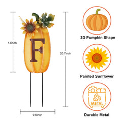 decorative garden stakes in a planter with fall flowers
