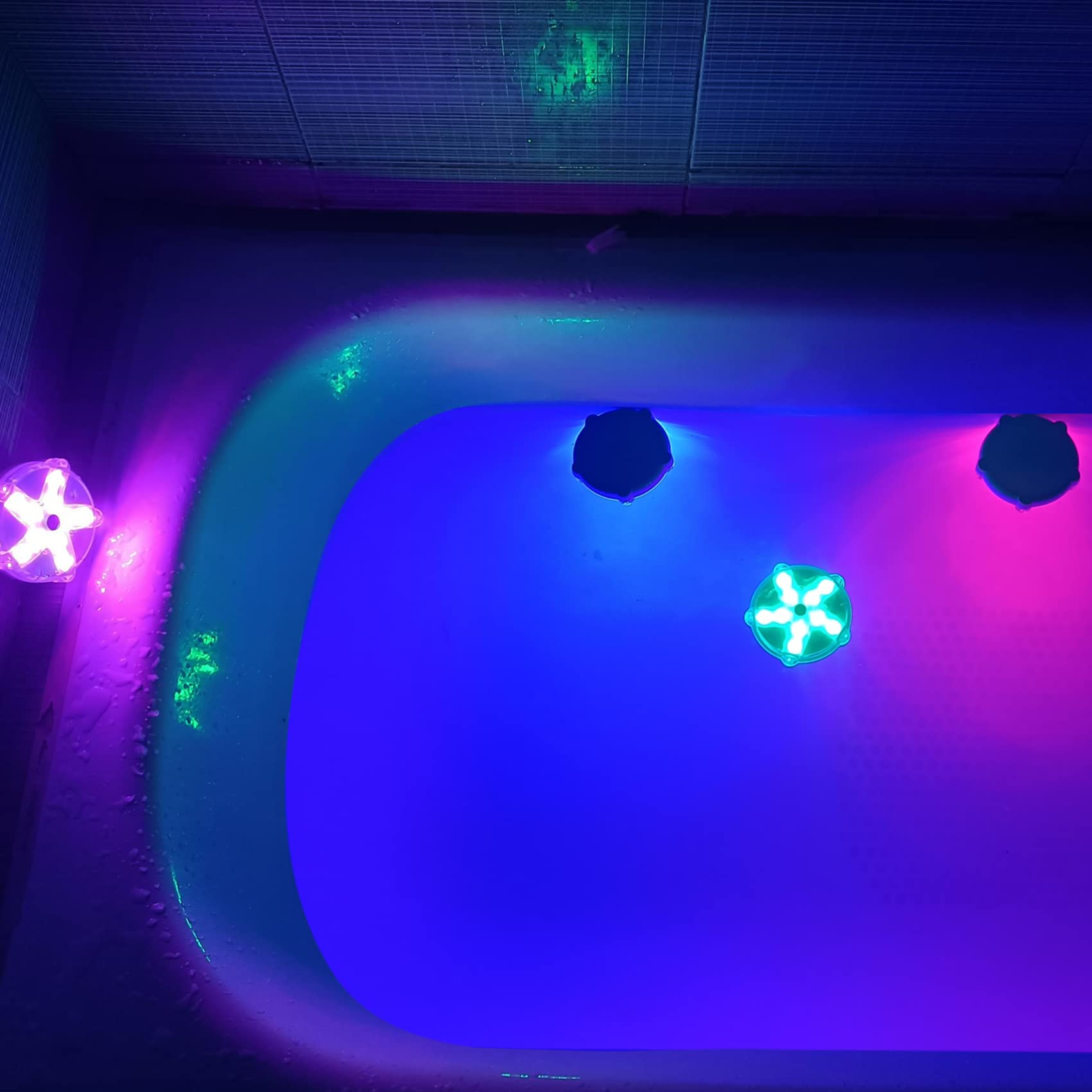 DeeprBetter Floating Pool Lights in a bathtub, illuminating the water