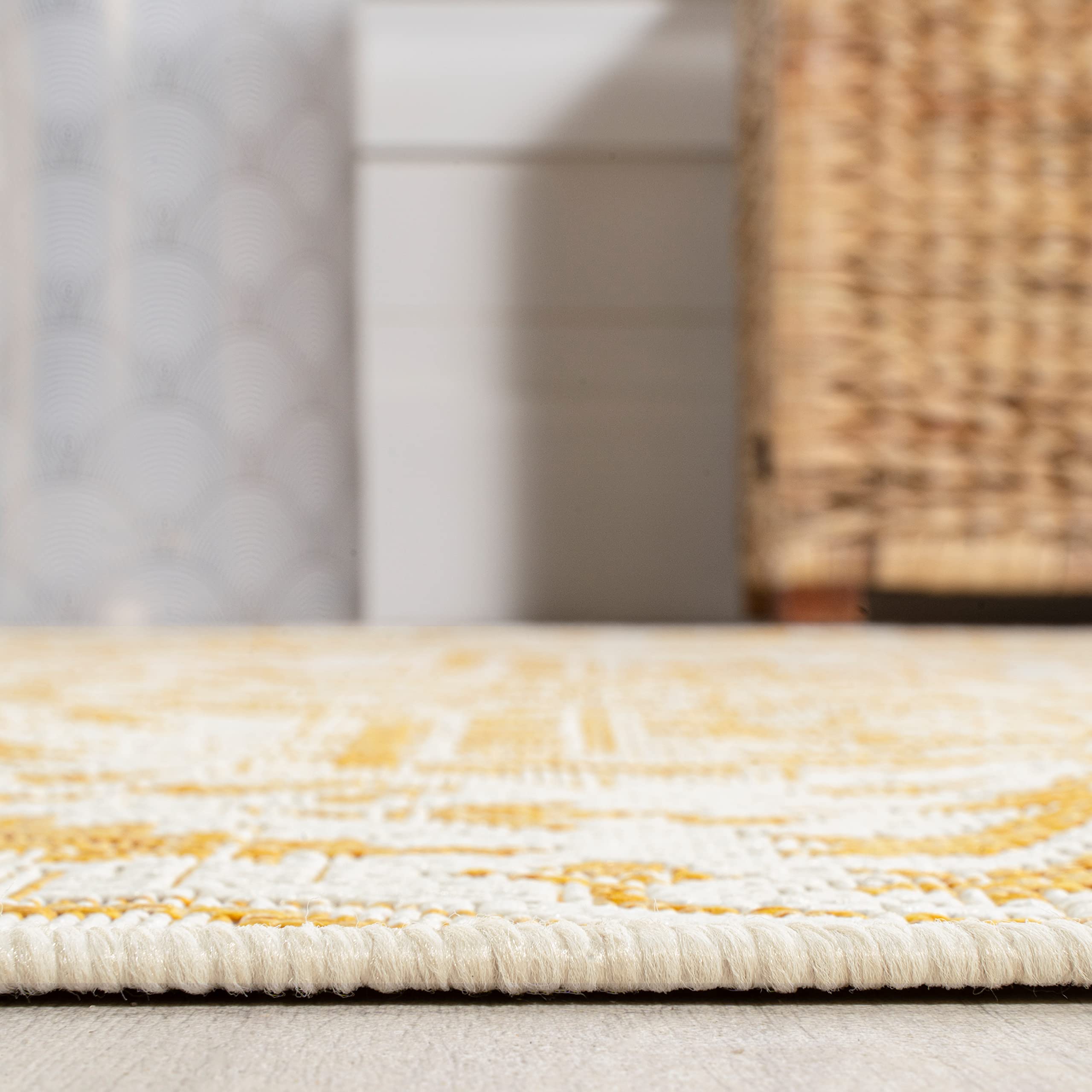 Detail of the cream and yellow pattern on JONATHAN Y rug