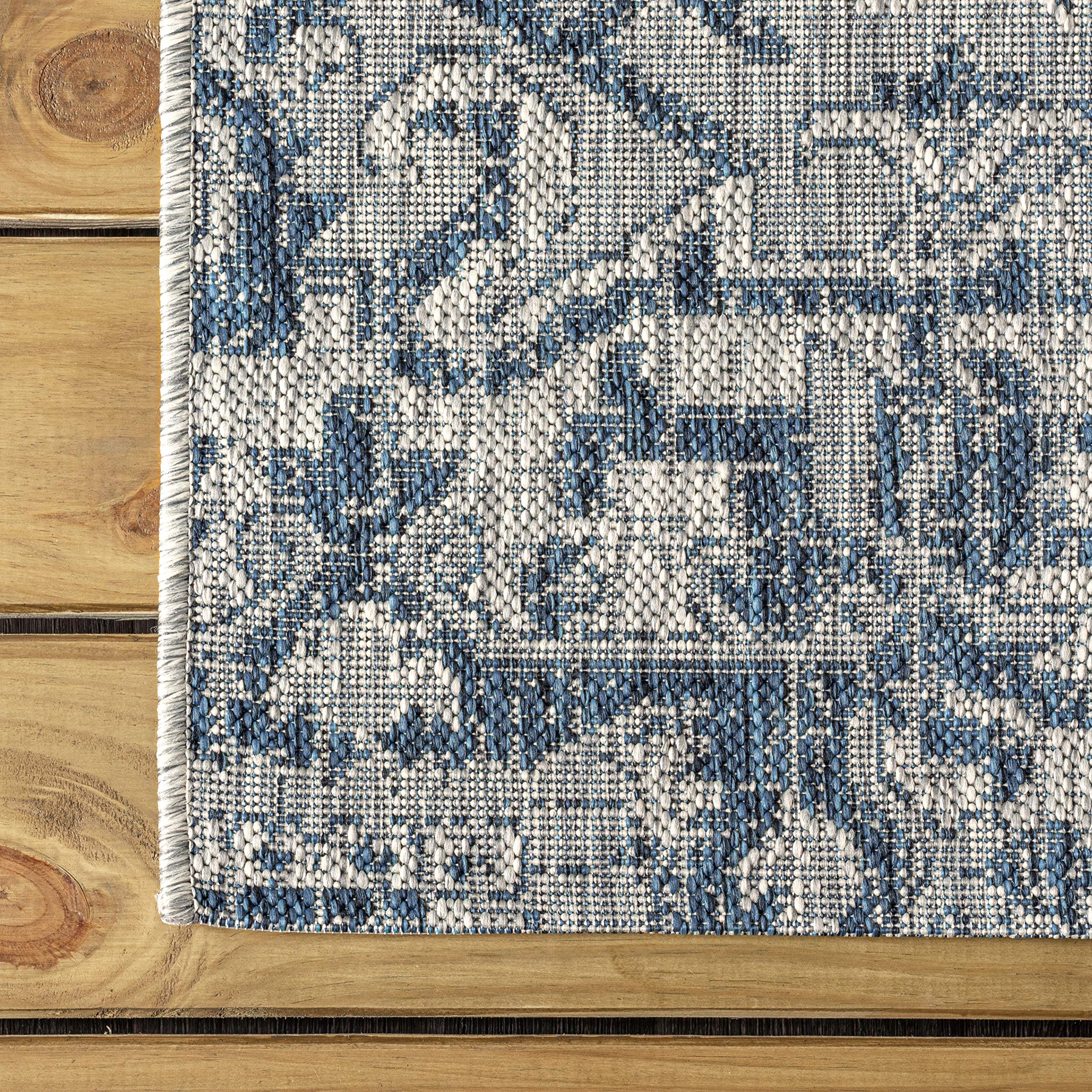Detail of the navy and gray tones in the JONATHAN Y rug