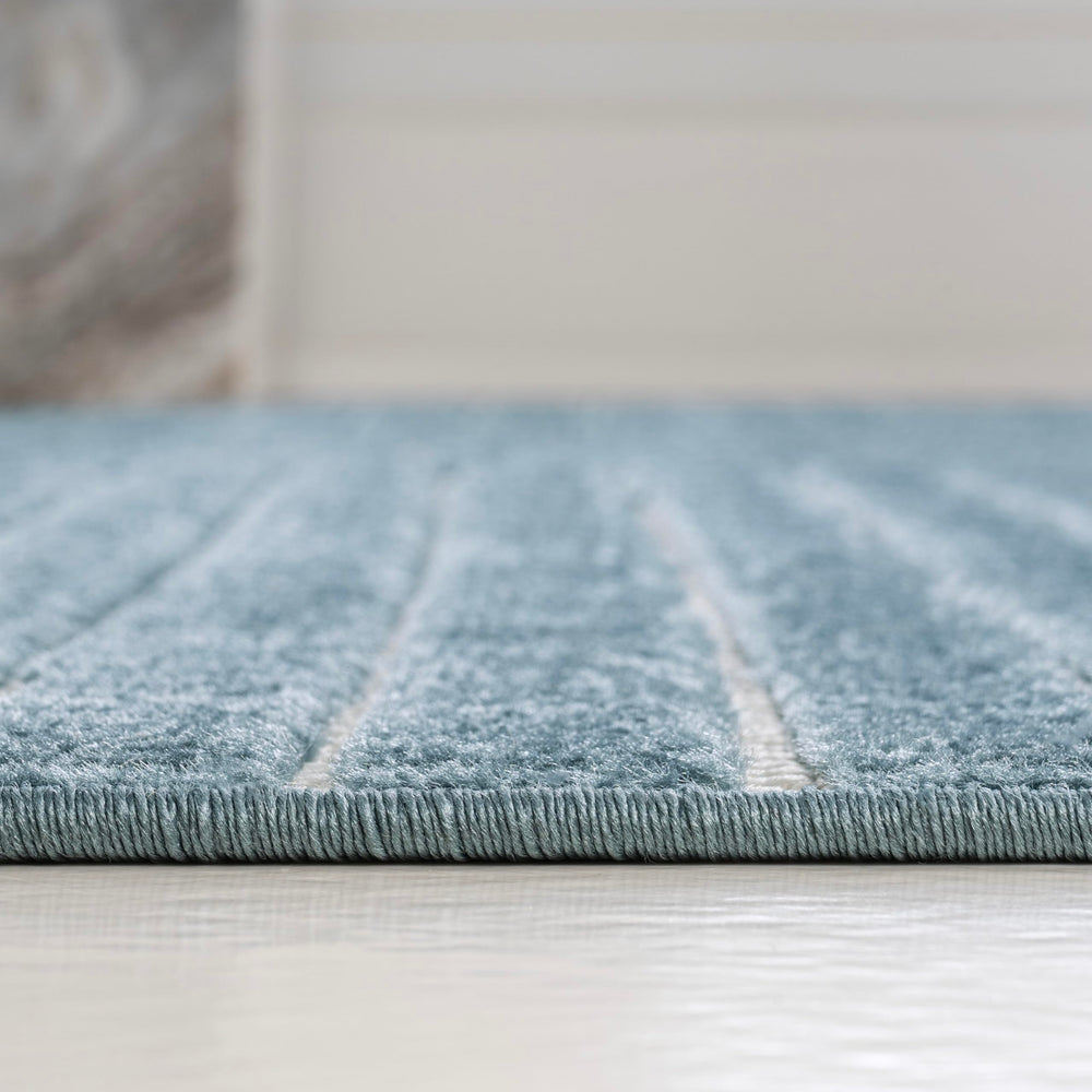 Detailed view of cream curved lines on JONATHAN Y Hallie rug