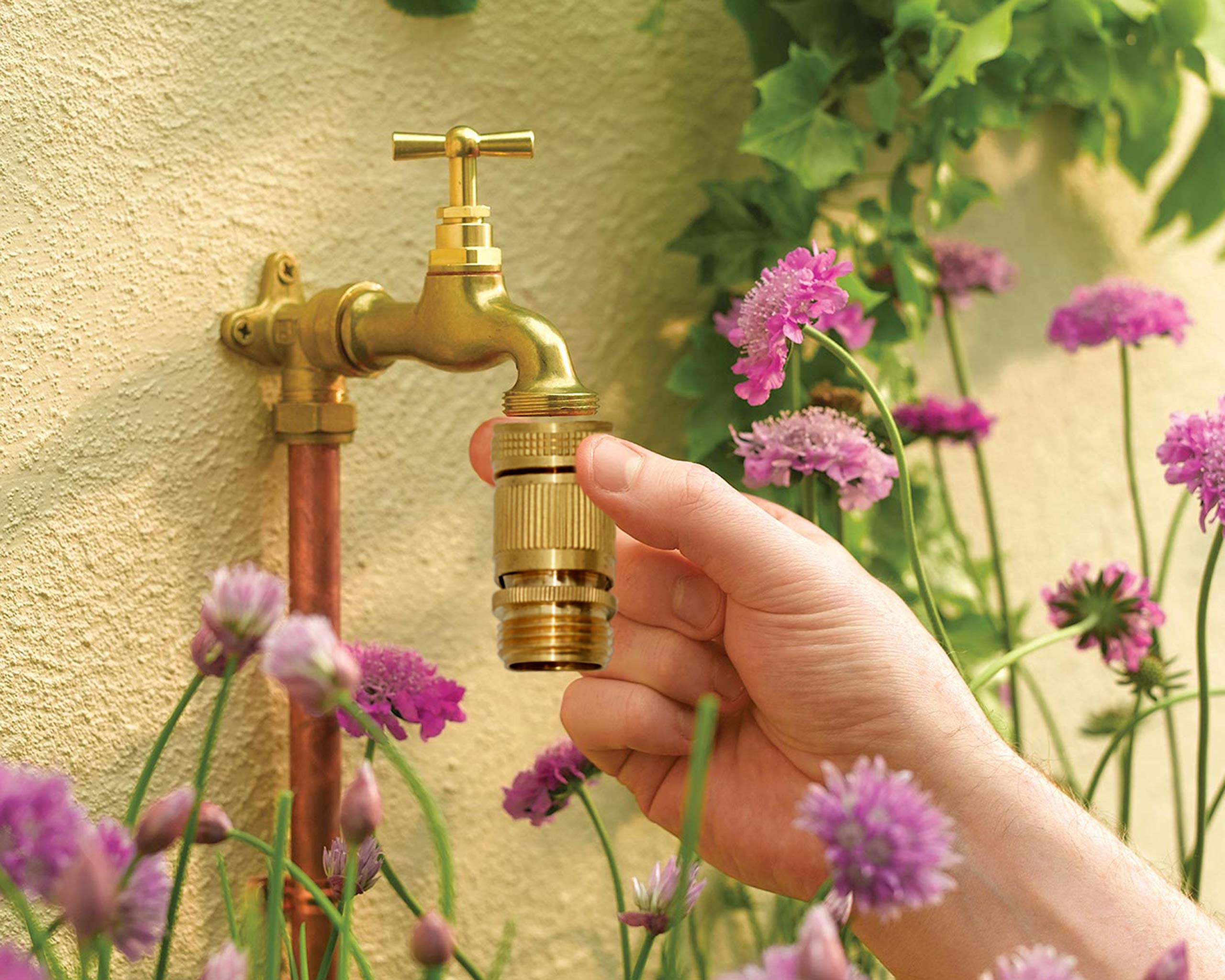 Detailed view of HQMPC brass connectors for garden hoses
