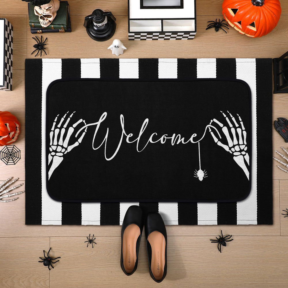 Detailed view of the Halloween door mat and striped rug together