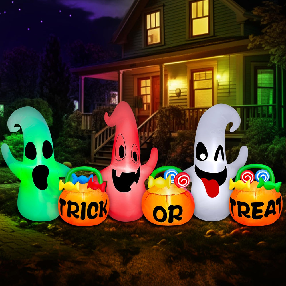 Detailed view of the pumpkin candy buckets with 'Trick or ' text