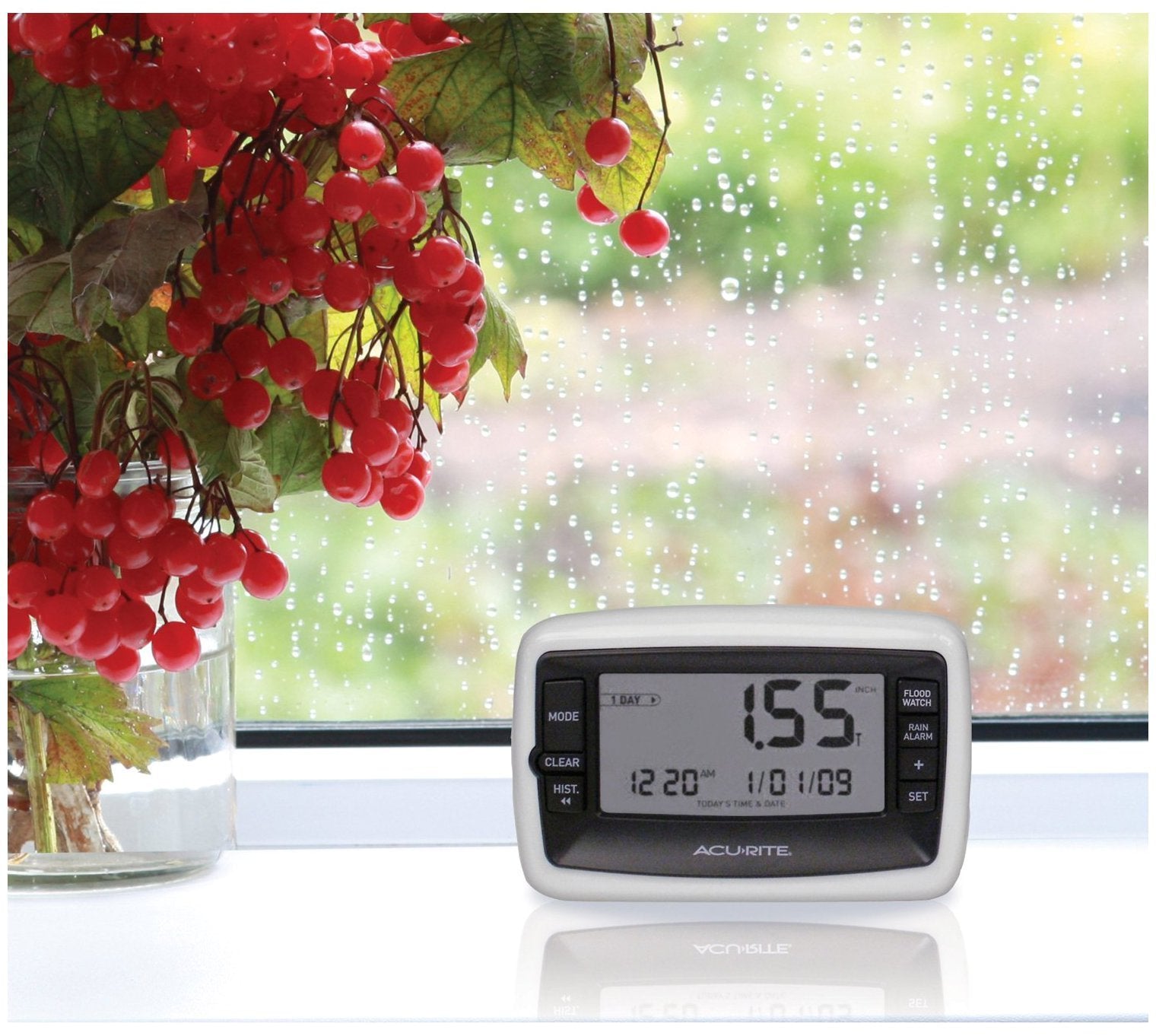 Digital display console of AcuRite rain gauge showing current date and time