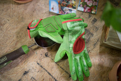 DIGZ Gardening Gloves on a hand using a touchscreen device