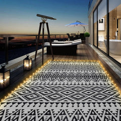 DiiKoo 6x9ft outdoor rug with LED lights, black and white geometric pattern