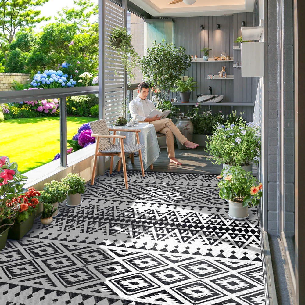 DiiKoo waterproof outdoor rug being cleaned with water