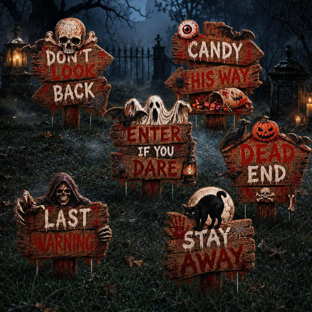 Display of Halloween yard signs in a garden setting