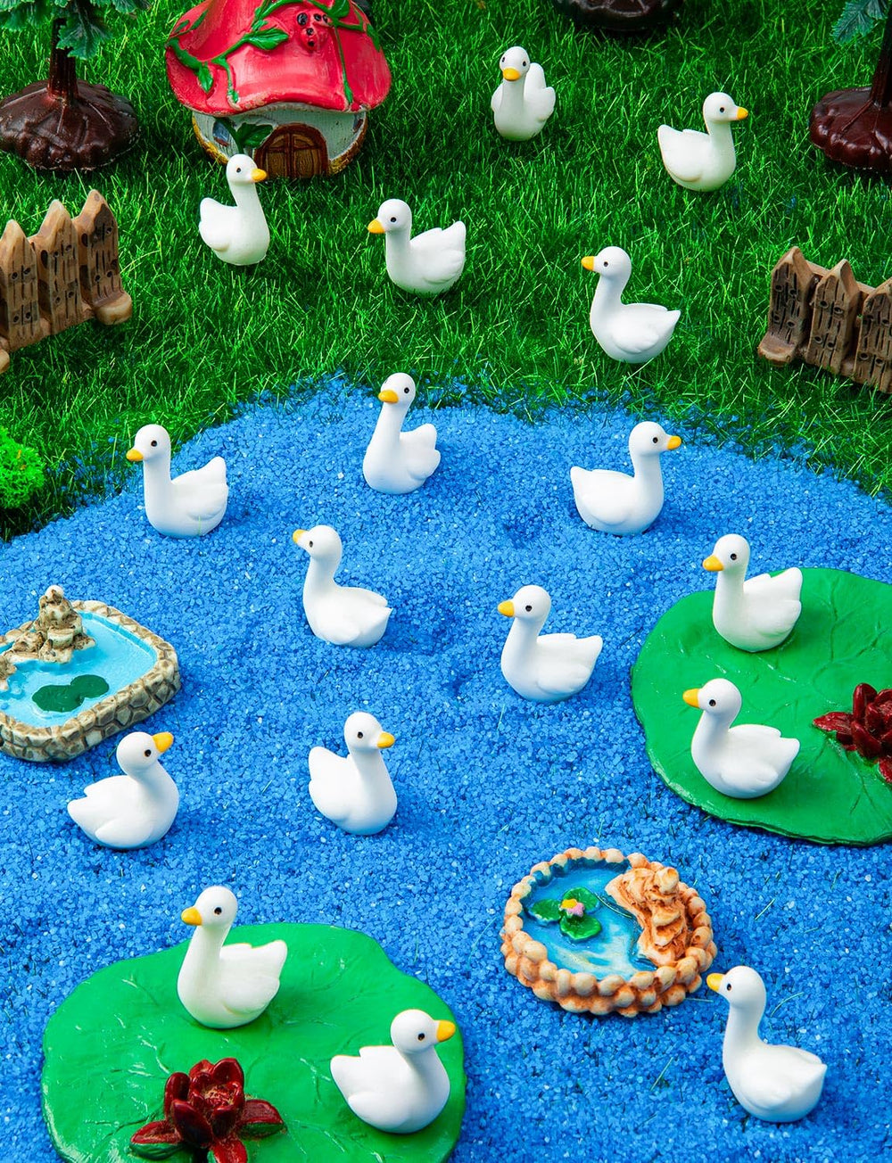 Display of LHSYFBZ Mini Resin Goose Figurines in a garden setting