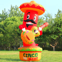 DomKom inflatable chili with LED lights set up in a garden