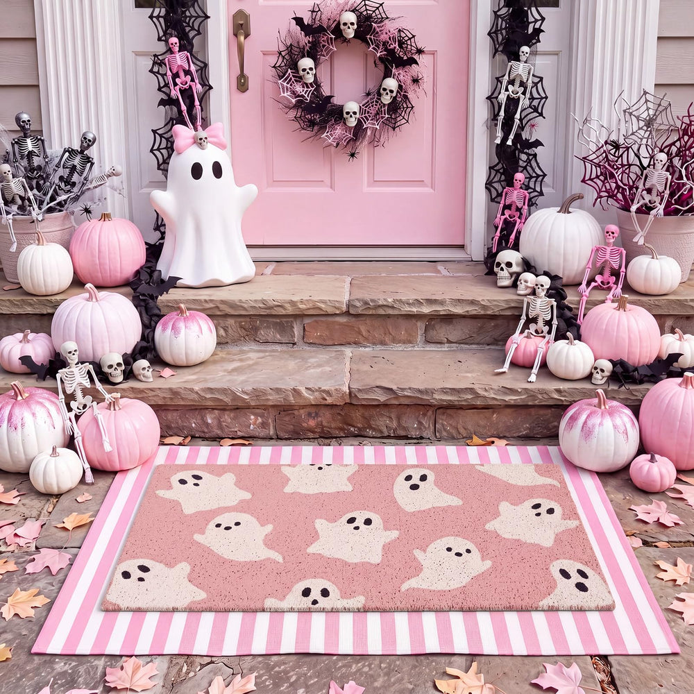 Doormat set displayed near a front door with Halloween decorations