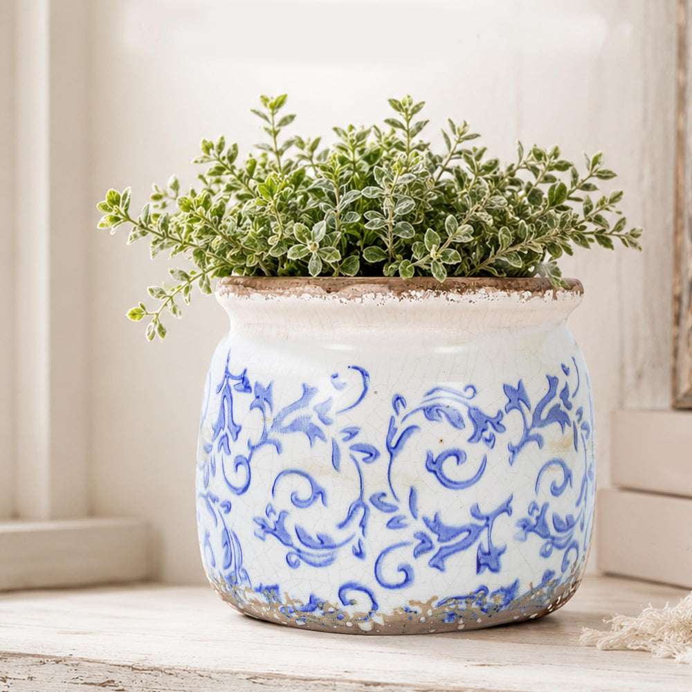 Dosayes Vintage Ceramic Flower Pot with small flowers planted inside