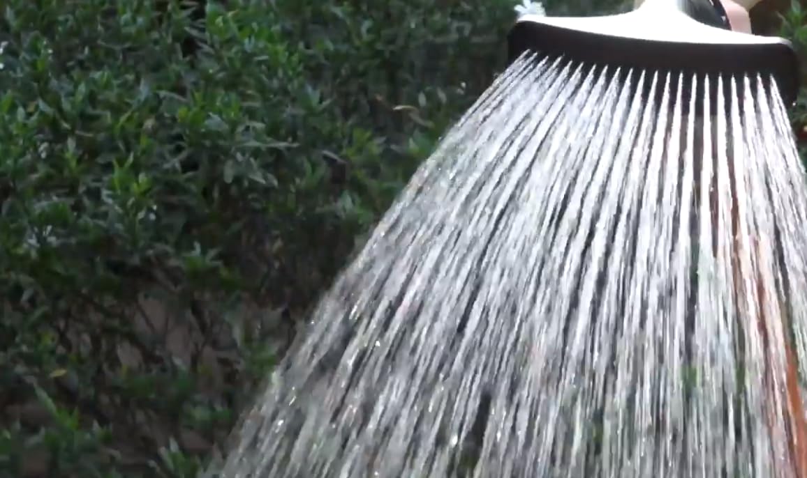 Dramm One Touch Fan Nozzle red in use watering plants