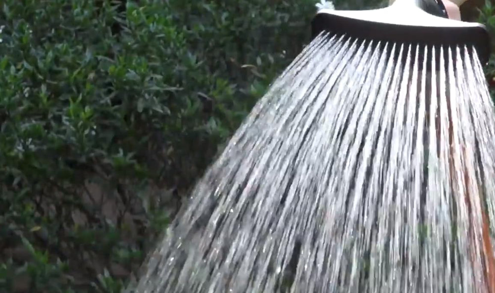 Dramm One Touch Fan Nozzle red in use watering plants