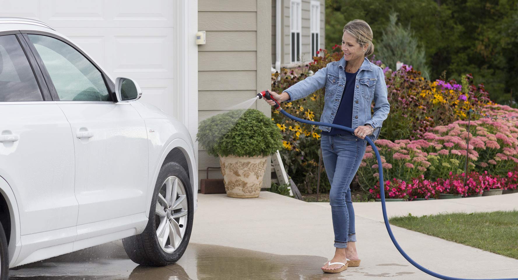 Dramm One Touch Twist Adjustable Spray Gun in use on a garden hose