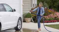 Dramm One Touch Twist Adjustable Spray Gun in use on a garden hose