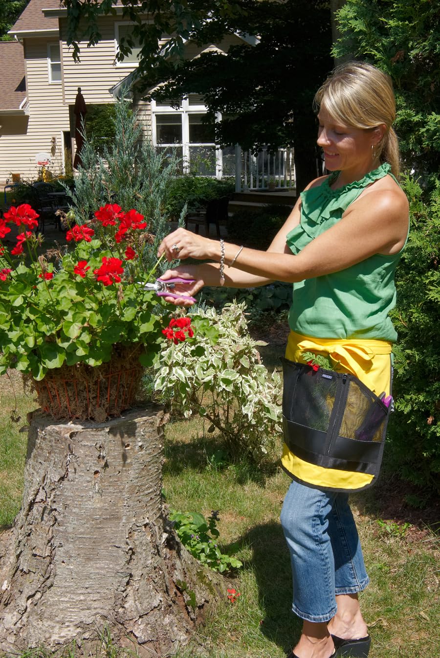 Dramm shears with a garden background showing usage in trimming plants