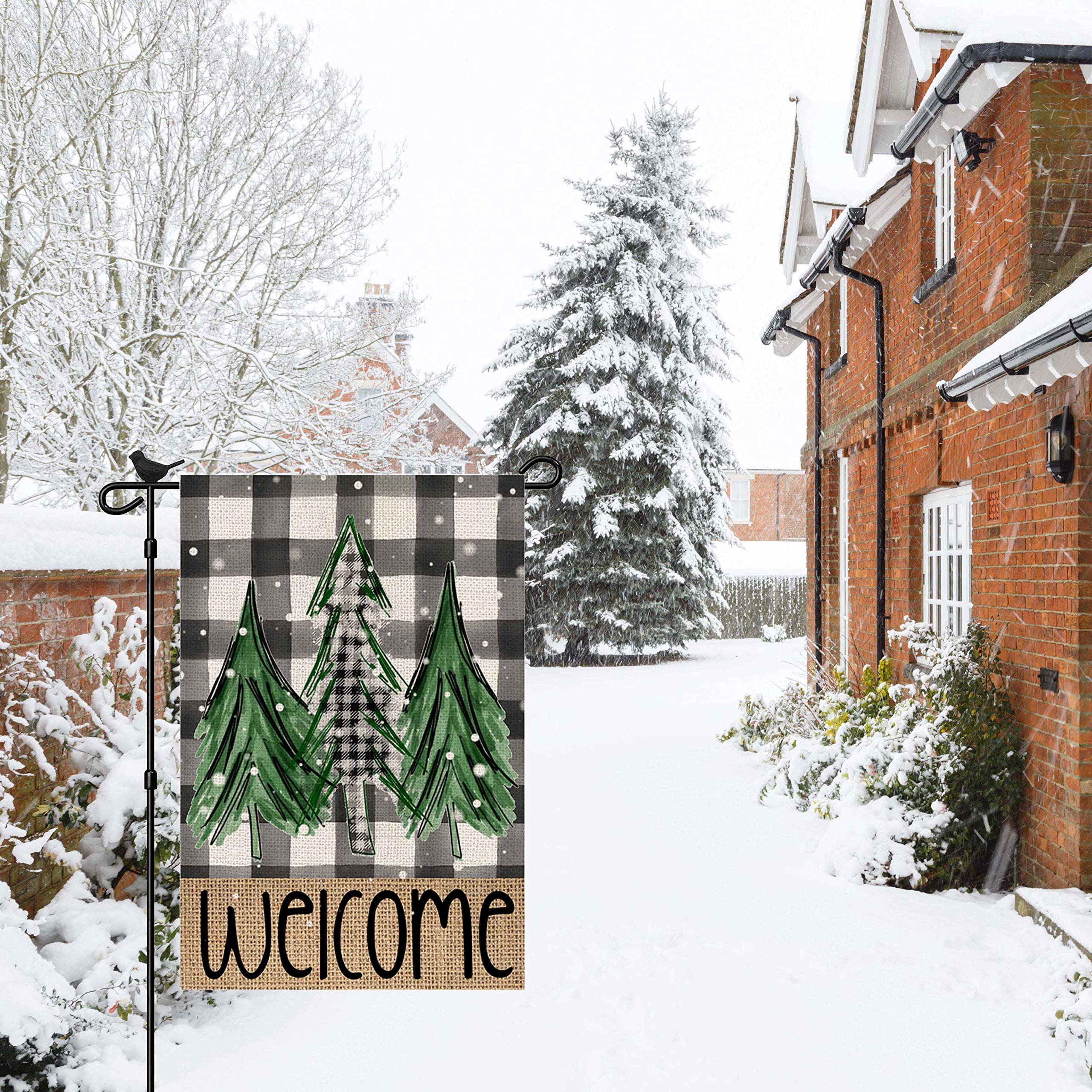Dsben Welcome Christmas Trees Garden Flag displayed in a garden setting