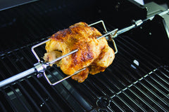 Dyna-Glo Rotisserie Kit installed on a grill with a roast