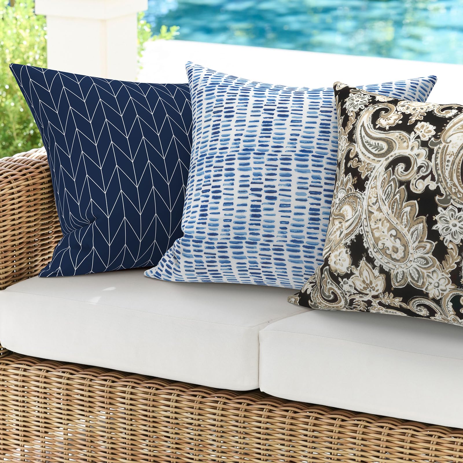 DYTXIII outdoor pillow displayed on a porch swing