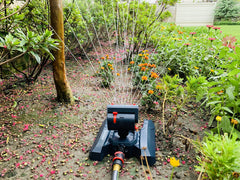 Eden Mini Turbo Oscillating Sprinkler on a lawn watering grass