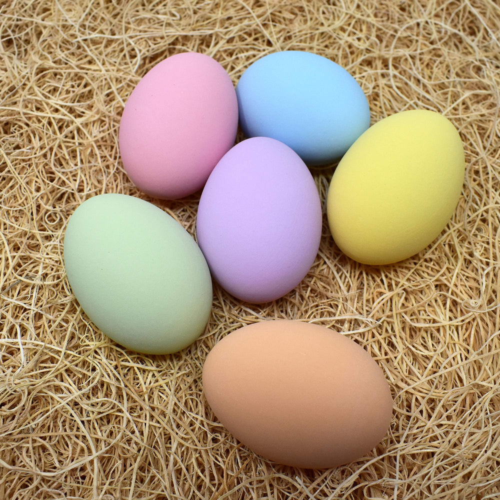Eggcetera ceramic nest eggs displayed in a decorative basket
