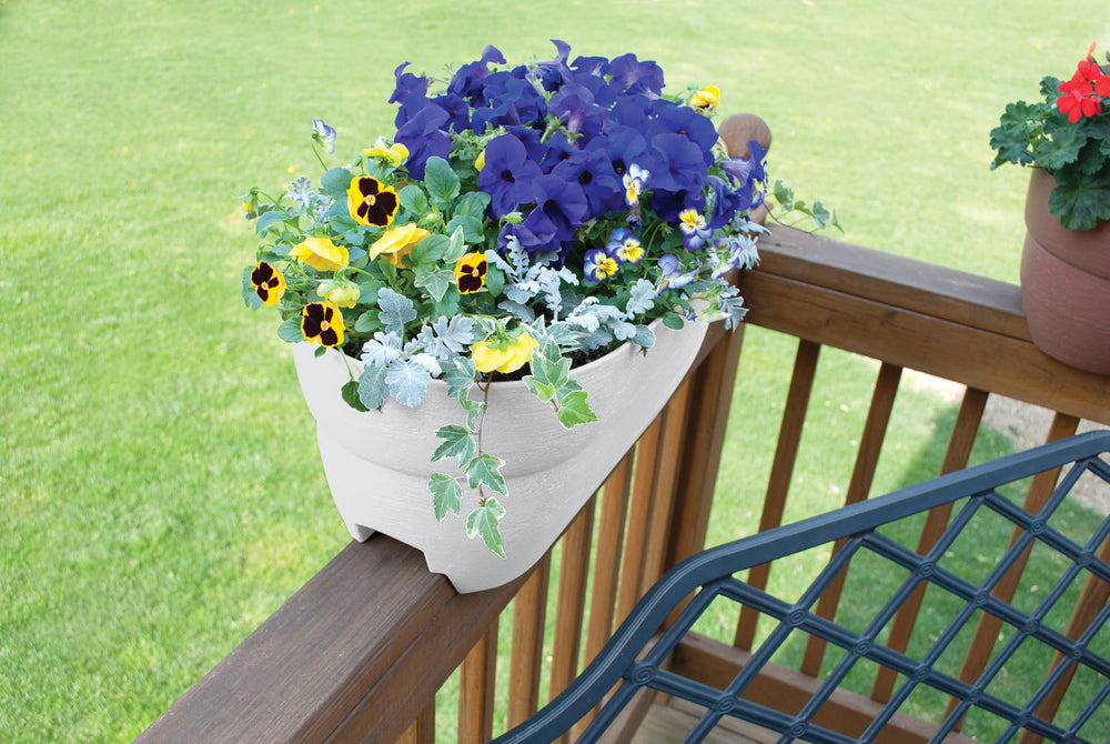 Emsco Group Bloomers Railing Planter mounted on a balcony railing