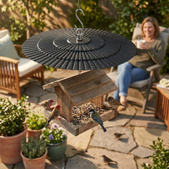 Eyrosa bird feeder rain guard installed on garden hook