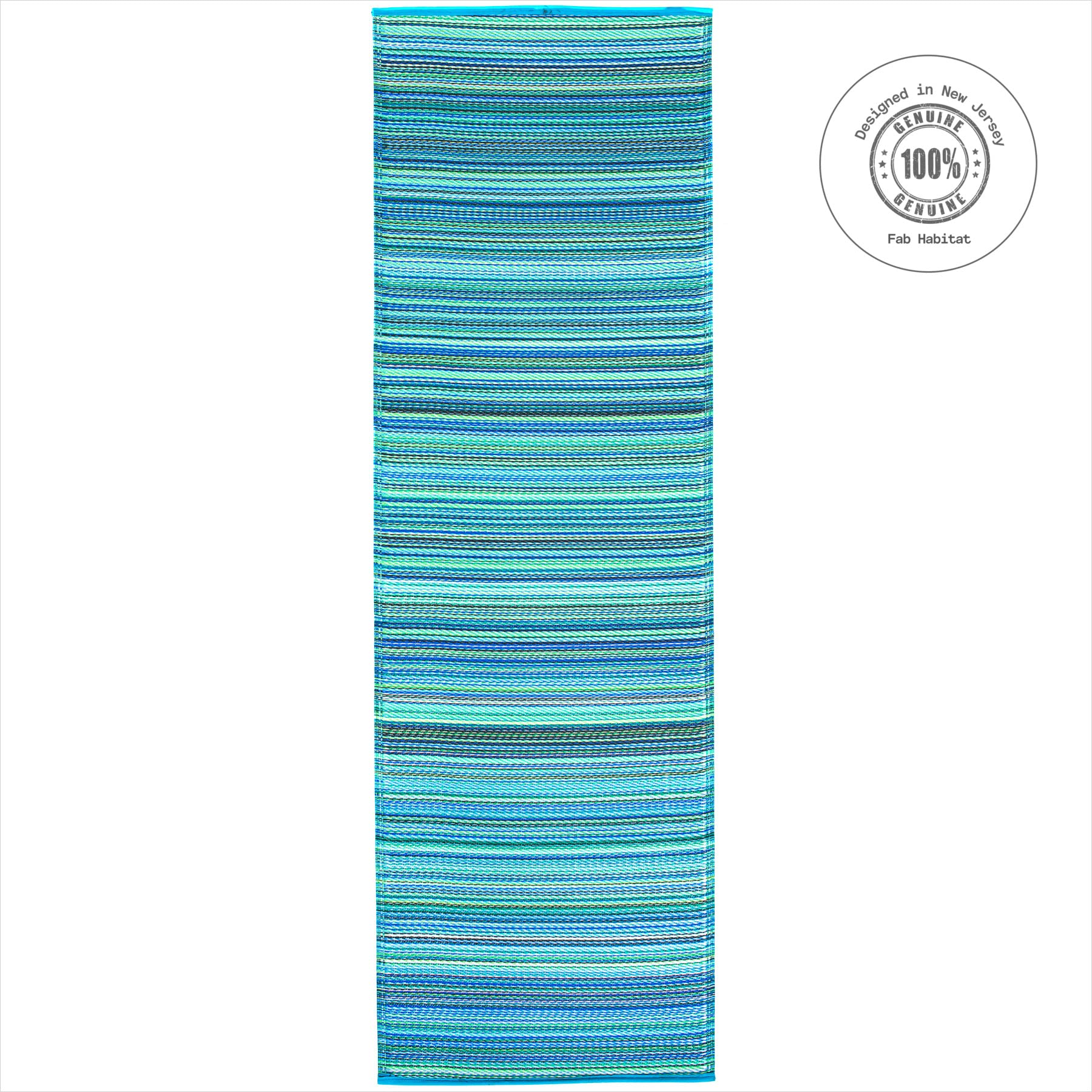 FAB HAB Outdoor Rug in turquoise and moss green on a patio