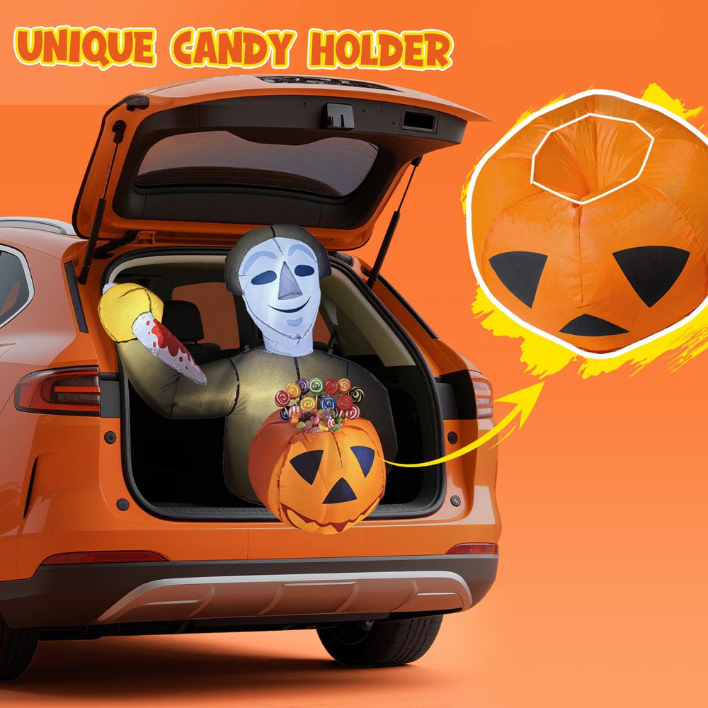 Family enjoying Halloween trunk or with inflatable decor