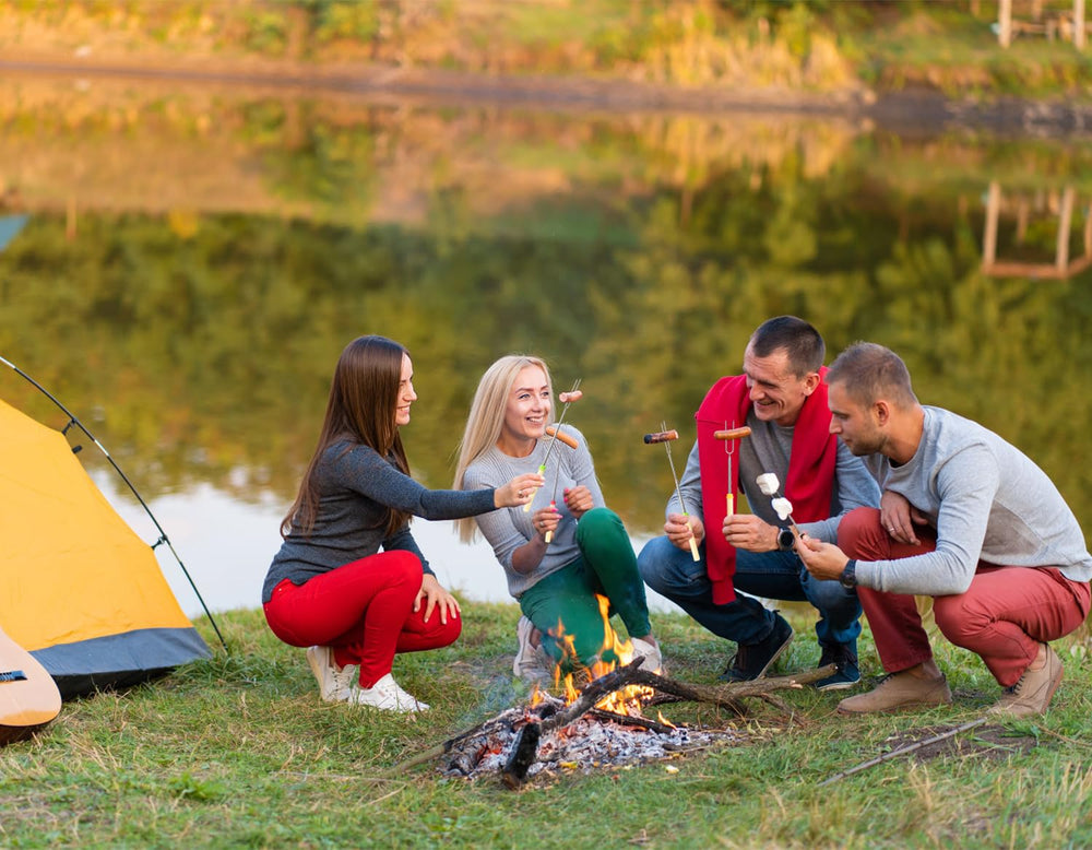 Family using DkOvn marshmallow roasting sticks by the campfire