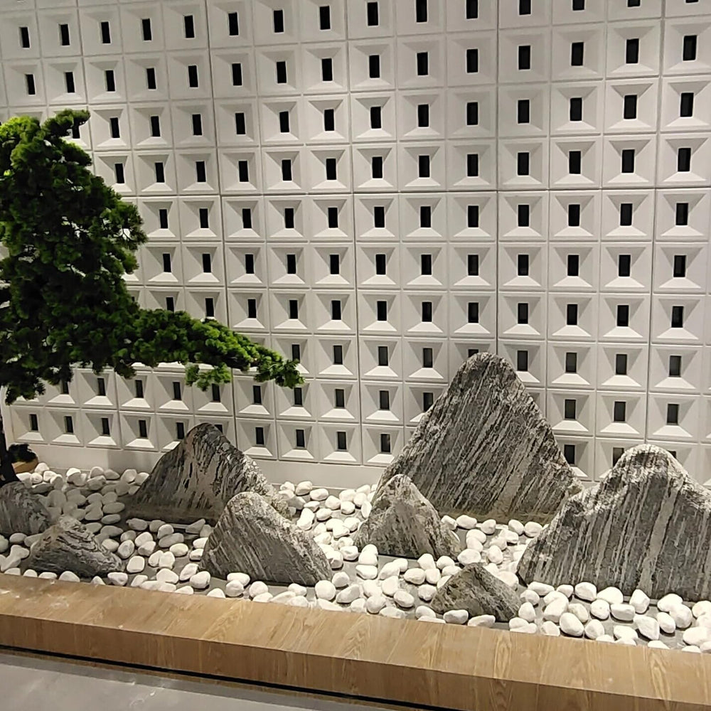 FANTIAN White Matte Rocks displayed in a garden setting