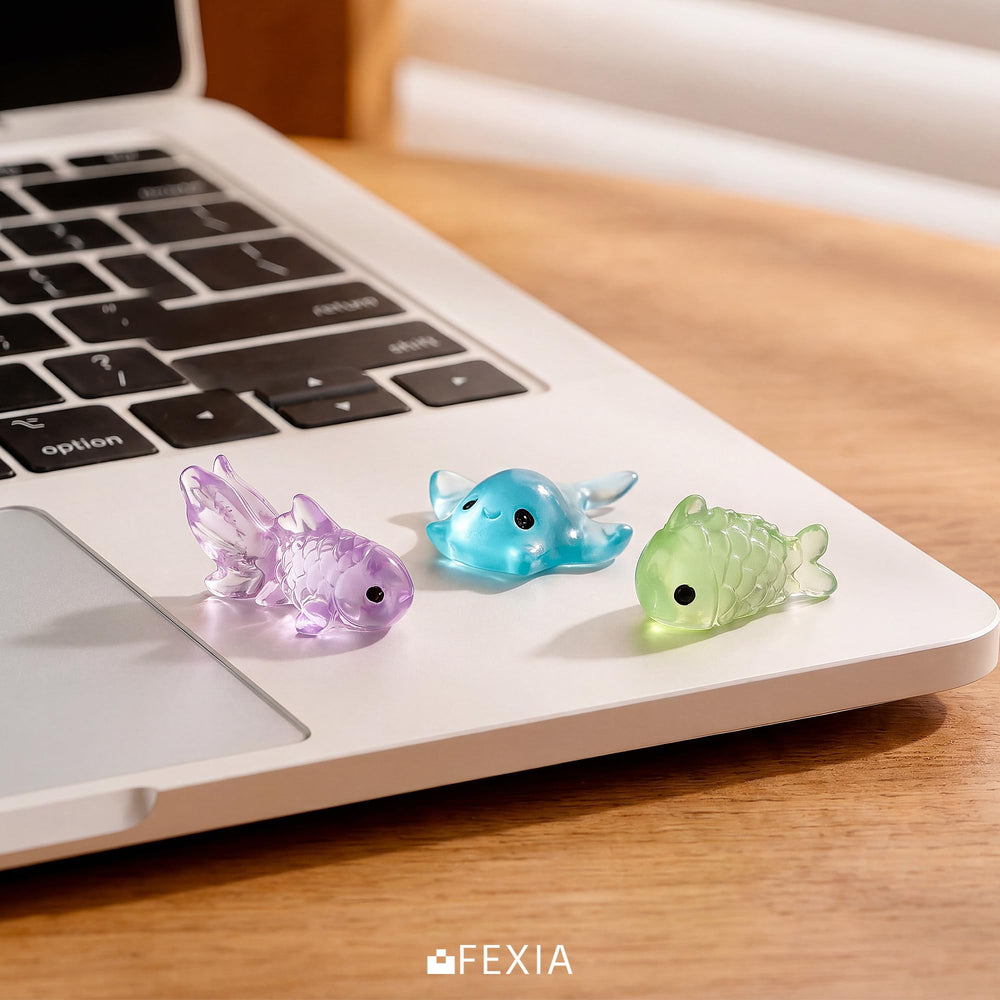 FEXIA Mini Resin Animal figurines on a table with other crafting materials