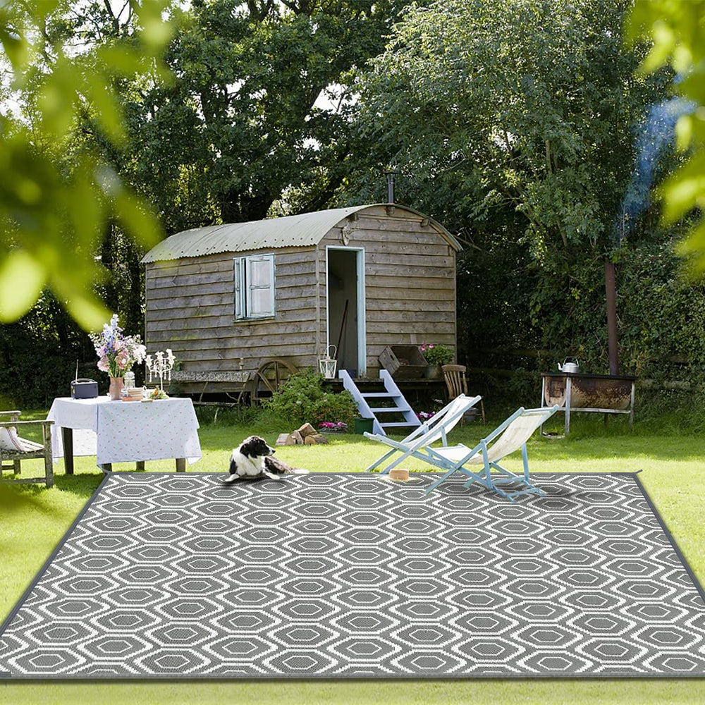 fifame outdoor rug displayed in a garden