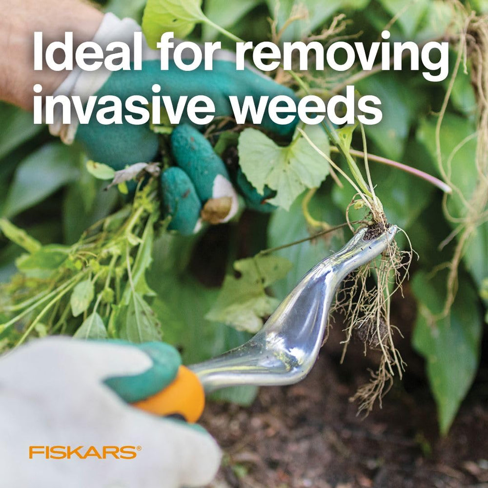 Fiskars Ergo Weeder in use removing dandelions from soil