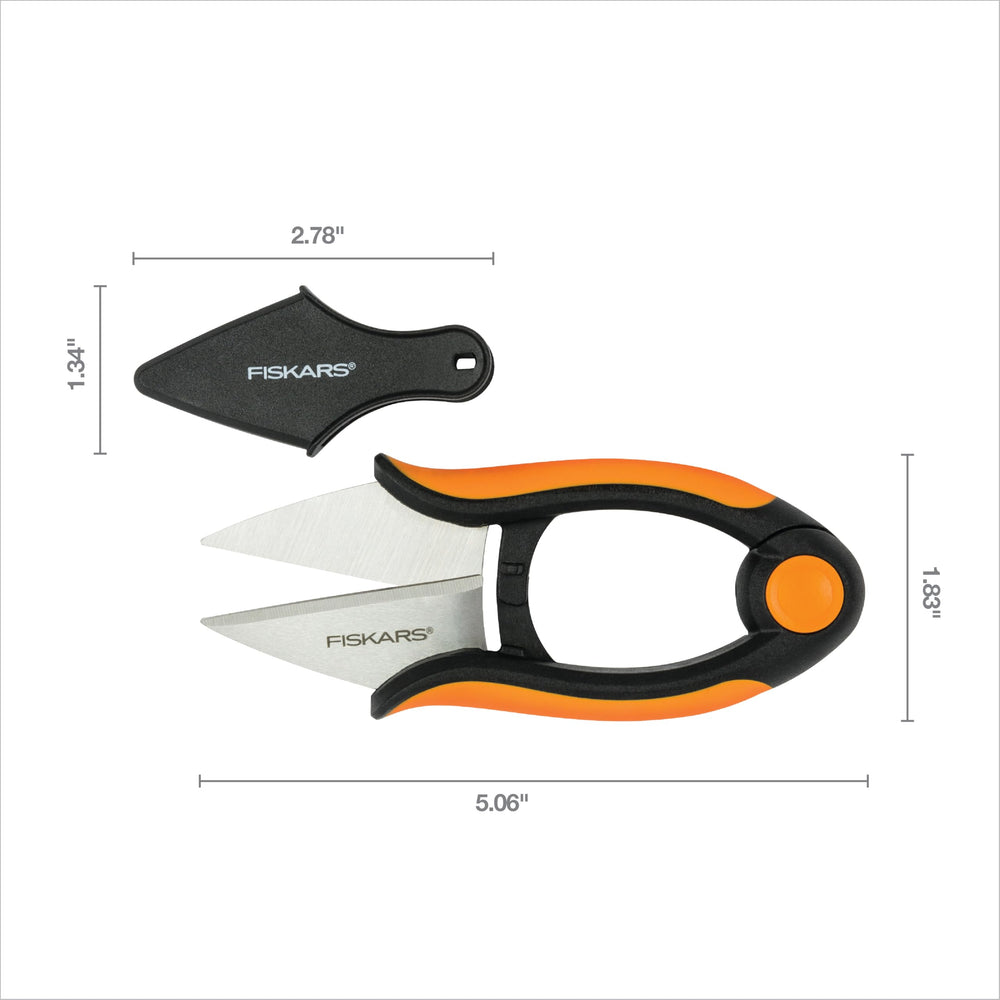 Fiskars Herb Snips with a backdrop of fresh herbs