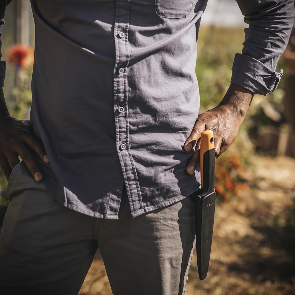Fiskars Hori Hori Knife displayed with plants