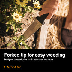 Fiskars Hori Hori Knife held by a gardener