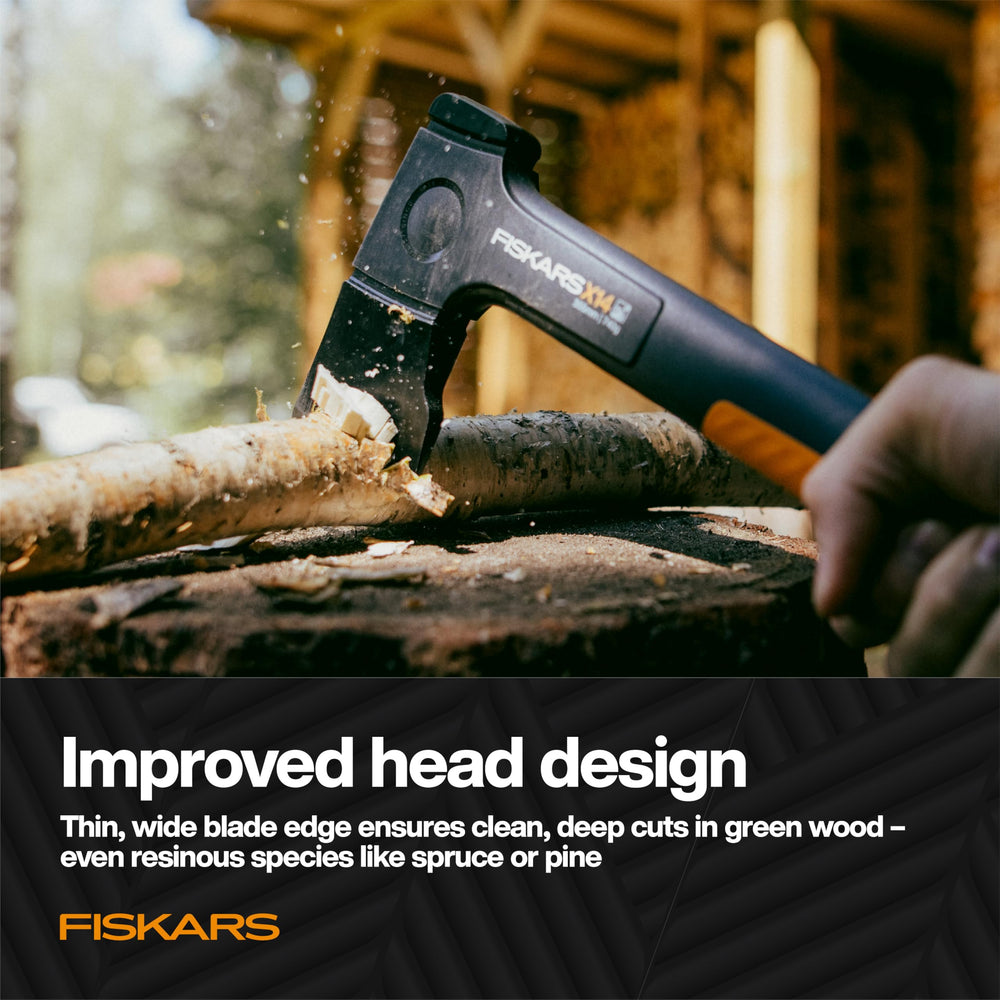 Fiskars X14 axe in use chopping wood