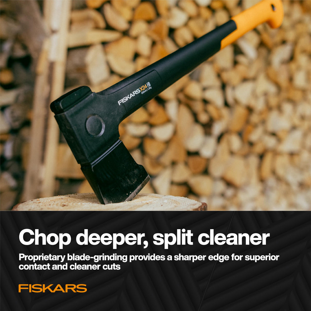 Fiskars X24 axe against a woodpile background