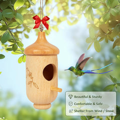Fitraho Hummingbird House in a garden setting with flowers
