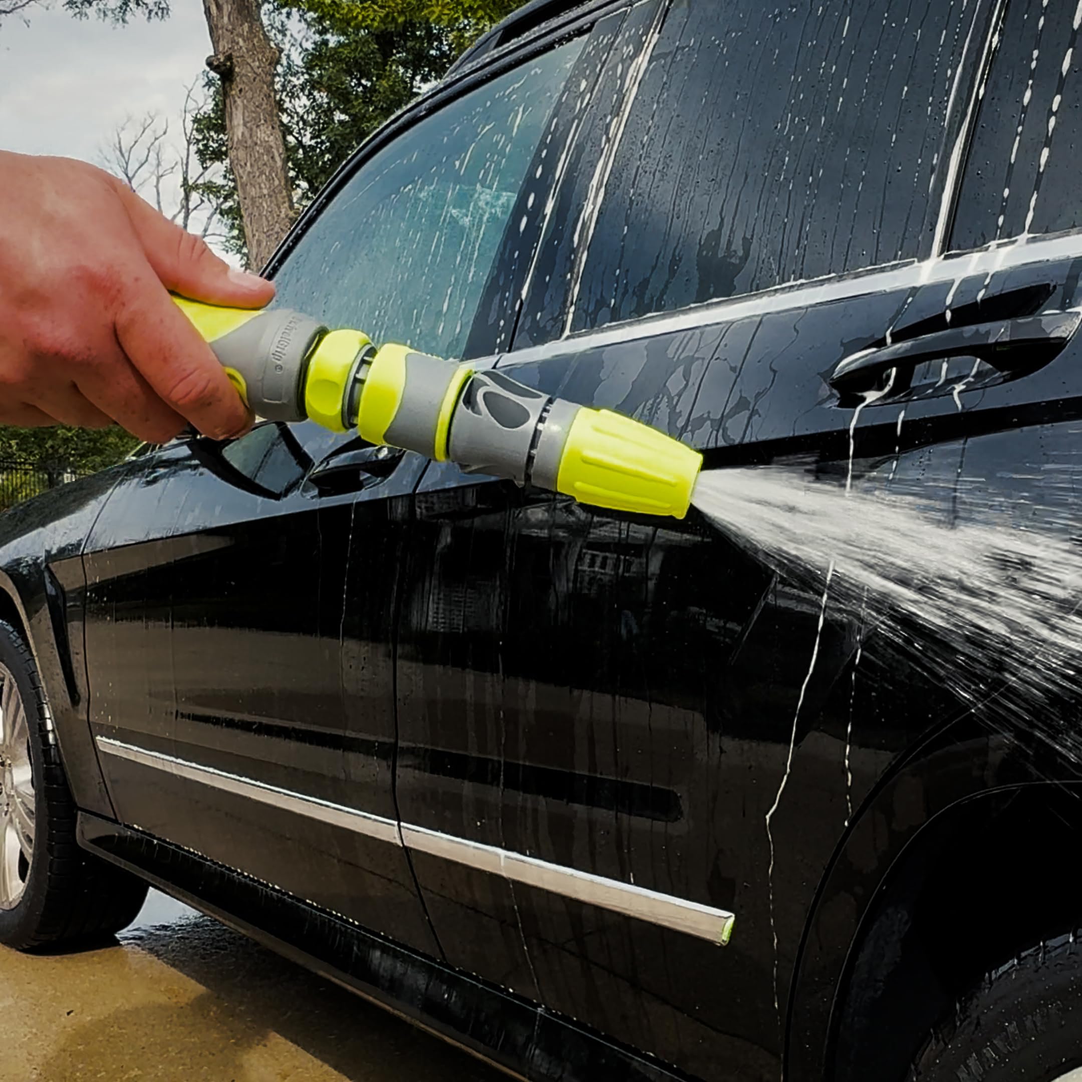 Flexzilla nozzle kit in use watering plants in a garden