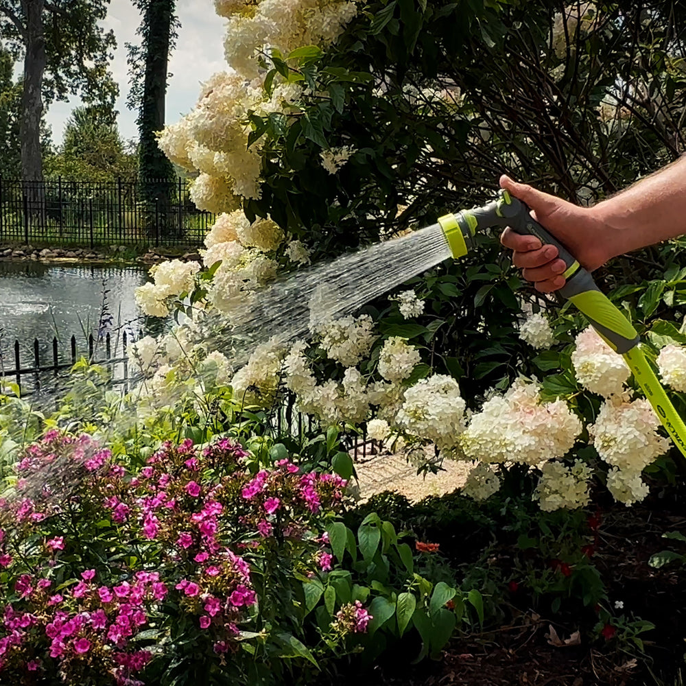 Flexzilla nozzle with a background of a garden